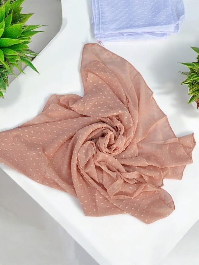 Here are some suggestions tailored to your Metallic Chiffon Hijabs: "Elegant Metallic Chiffon Hijab in shimmering silver, lightweight and breathable." "Close-up of soft, non-slip Metallic Chiffon Hijab draped elegantly." "Model wearing a Metallic Chiffon Hijab in rose gold, styled for a formal occasion." "Flat lay of Metallic Chiffon Hijabs in multiple colors, perfect for modest fashion." "Shimmering Metallic Chiffon Hijab folded neatly, showcasing its luxurious fabric."