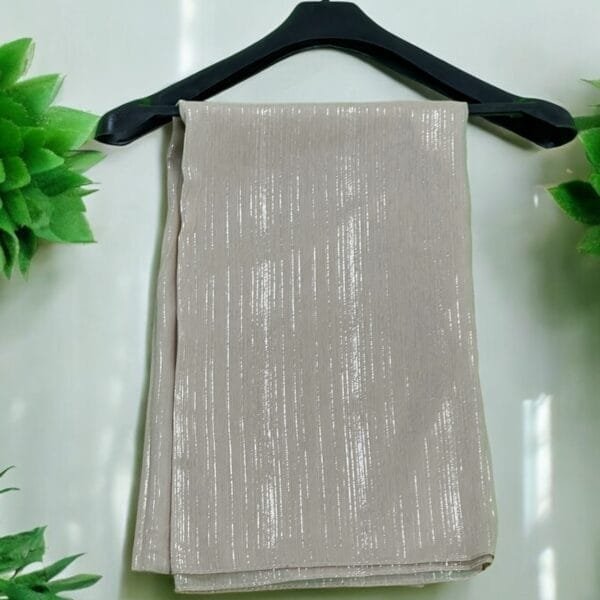 Here are some suggestions tailored to your Metallic Chiffon Hijabs: "Elegant Metallic Chiffon Hijab in shimmering silver, lightweight and breathable." "Close-up of soft, non-slip Metallic Chiffon Hijab draped elegantly." "Model wearing a Metallic Chiffon Hijab in rose gold, styled for a formal occasion." "Flat lay of Metallic Chiffon Hijabs in multiple colors, perfect for modest fashion." "Shimmering Metallic Chiffon Hijab folded neatly, showcasing its luxurious fabric."
