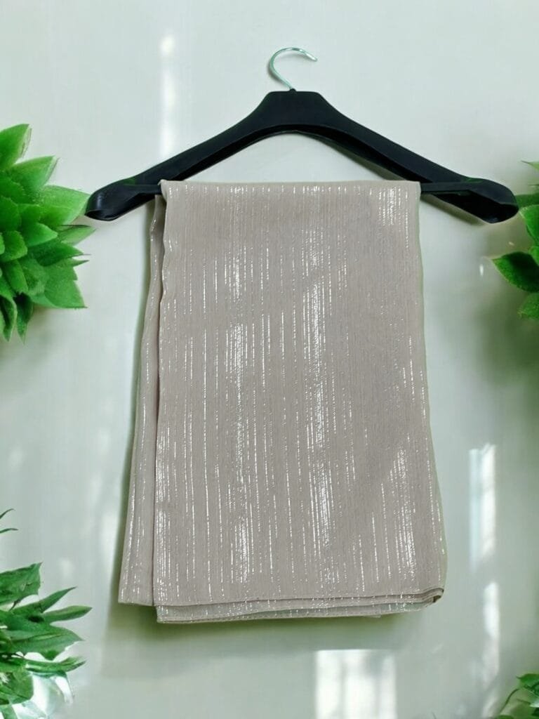 Here are some suggestions tailored to your Metallic Chiffon Hijabs: "Elegant Metallic Chiffon Hijab in shimmering silver, lightweight and breathable." "Close-up of soft, non-slip Metallic Chiffon Hijab draped elegantly." "Model wearing a Metallic Chiffon Hijab in rose gold, styled for a formal occasion." "Flat lay of Metallic Chiffon Hijabs in multiple colors, perfect for modest fashion." "Shimmering Metallic Chiffon Hijab folded neatly, showcasing its luxurious fabric."