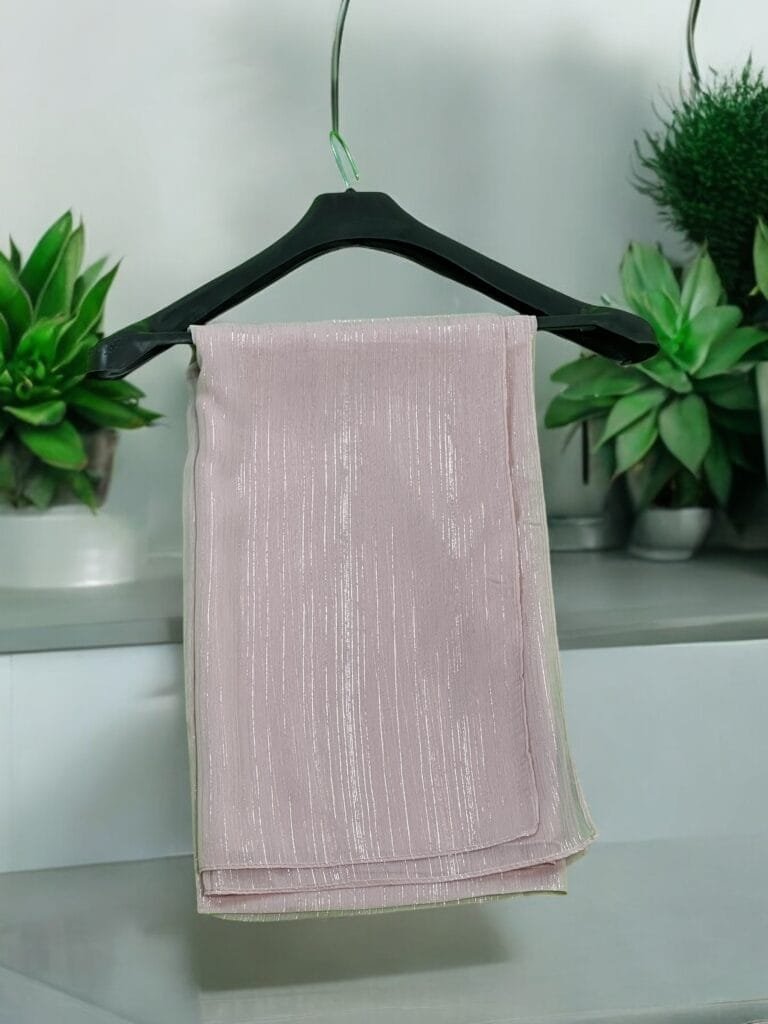 Here are some suggestions tailored to your Metallic Chiffon Hijabs: "Elegant Metallic Chiffon Hijab in shimmering silver, lightweight and breathable." "Close-up of soft, non-slip Metallic Chiffon Hijab draped elegantly." "Model wearing a Metallic Chiffon Hijab in rose gold, styled for a formal occasion." "Flat lay of Metallic Chiffon Hijabs in multiple colors, perfect for modest fashion." "Shimmering Metallic Chiffon Hijab folded neatly, showcasing its luxurious fabric."