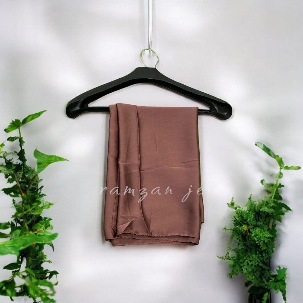 "Elegant long hijab in soft chiffon fabric, perfect for modest fashion."