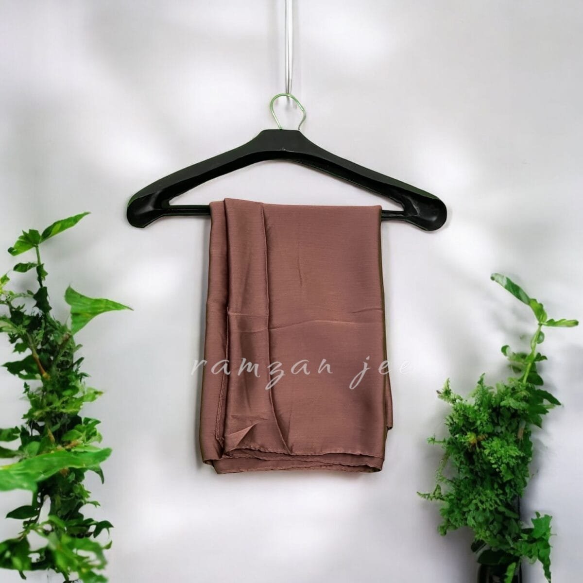 "Elegant long hijab in soft chiffon fabric, perfect for modest fashion."