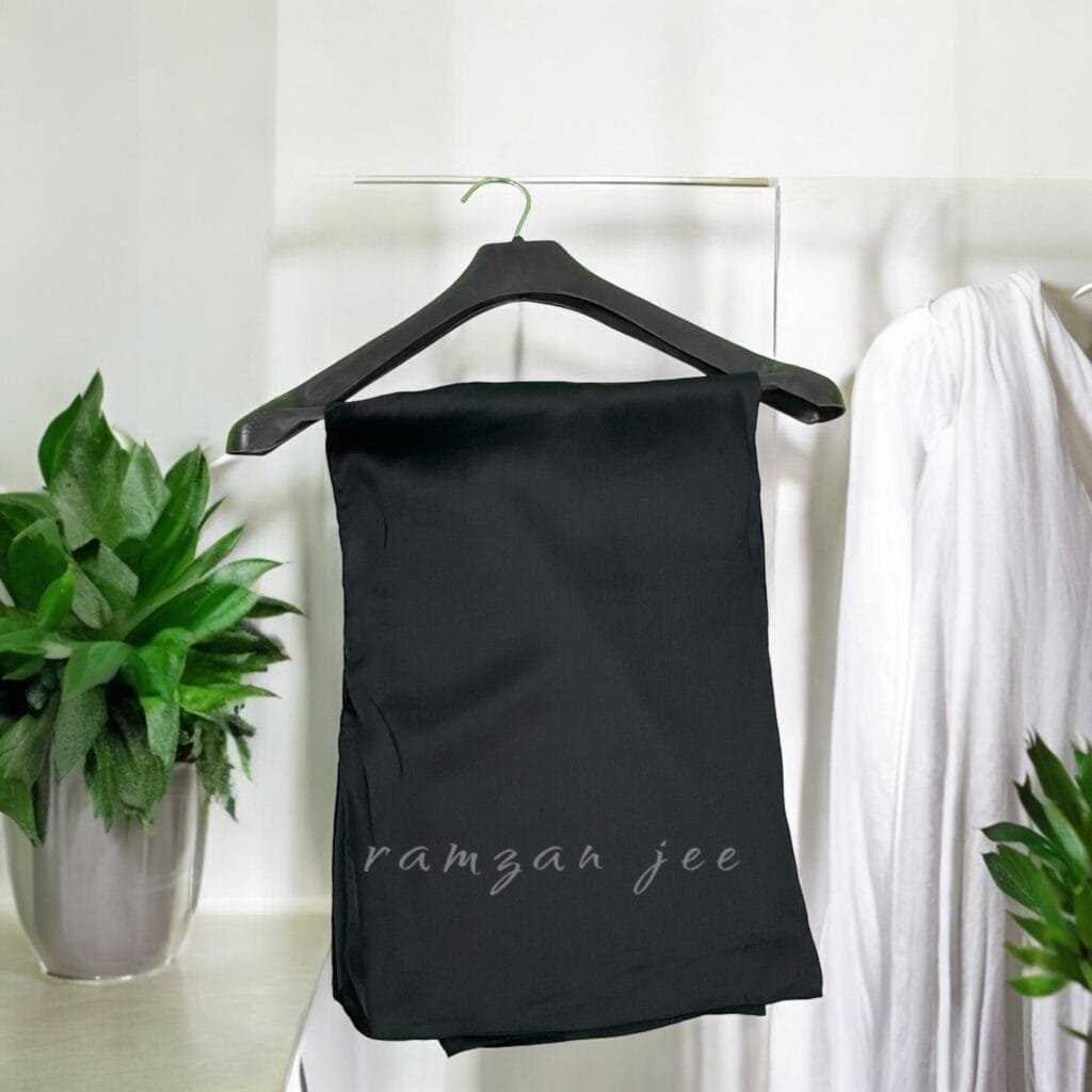 "Versatile silk hijab styled for casual and formal occasions." "Premium modest fashion silk hijab draped elegantly over shoulders."