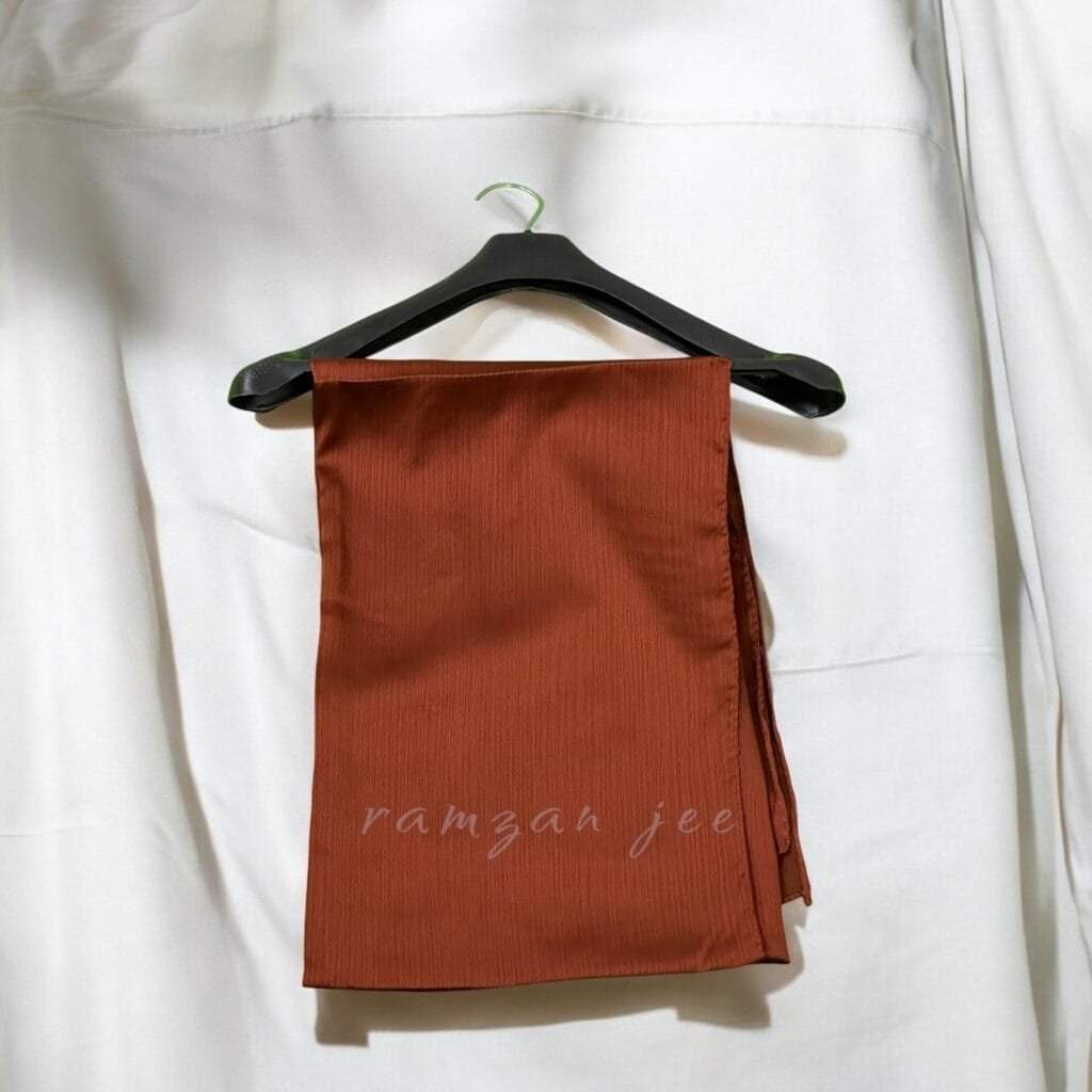 Elevate your wardrobe with our luxurious long hijabs, designed for modern women who value both modesty and elegance. Made from premium, breathable fabrics, these hijabs are perfect for everyday wear, special occasions, or professional settings. Our hijabs are thoughtfully crafted to provide full coverage while ensuring maximum comfort throughout the day. With a variety of rich colors, classic designs, and contemporary styles, these hijabs are a must-have for every woman seeking modest fashion with a touch of sophistication. Features and Benefits: High-Quality Material: Crafted from lightweight, soft, and durable fabrics such as chiffon, jersey, and silk. These materials ensure a wrinkle-free, breathable, and non-slip fit all day long. Generous Length and Coverage: Measuring [insert dimensions], our long hijabs offer full coverage, making them ideal for layering, draping, or styling in various ways. Versatile Styling Options: Perfect for casual outings, professional environments, or elegant evening wear. Achieve a polished look whether you choose a simple wrap, layered folds, or an intricate turban style. Vibrant and Neutral Color Options: Available in a curated palette, including classic black hijabs, soft pastel tones, and bold statement colors to suit your style and mood. Easy Maintenance: Machine-washable and designed to maintain their quality, these hijabs are built for effortless care and longevity. Why Choose Our Hijabs? Fashion Meets Functionality: Designed to combine tradition with contemporary trends. Perfect for Every Occasion: From daily wear hijabs to those ideal for formal events like weddings, Eid, or Ramadan gatherings. Inclusive and Modest: Ideal for women of all ages and backgrounds, respecting diverse needs and preferences. Care Instructions: Hand wash or machine wash on a delicate cycle. Hang to dry to maintain the fabric’s texture and softness. Iron on low heat if needed.