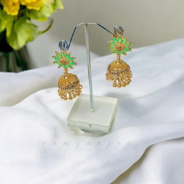 "Elegant earrings with intricate designs, perfect for formal events and evening wear. Available in statement chandelier and drop styles."