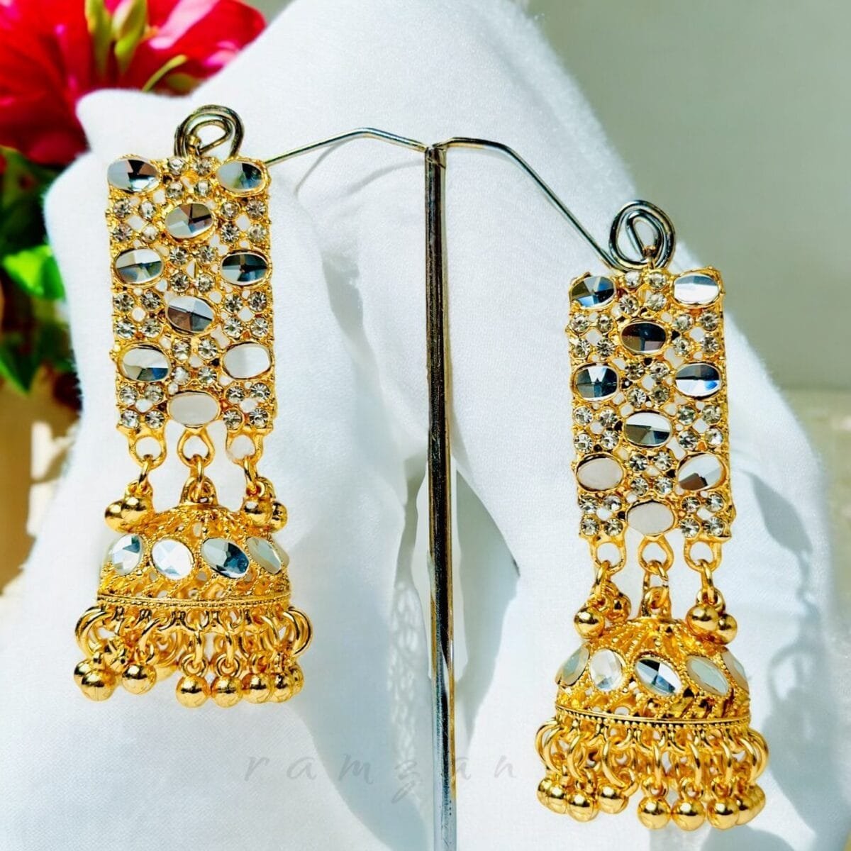 "Elegant earrings with intricate designs, perfect for formal events and evening wear. Available in statement chandelier and drop styles."
