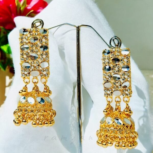 "Elegant earrings with intricate designs, perfect for formal events and evening wear. Available in statement chandelier and drop styles."