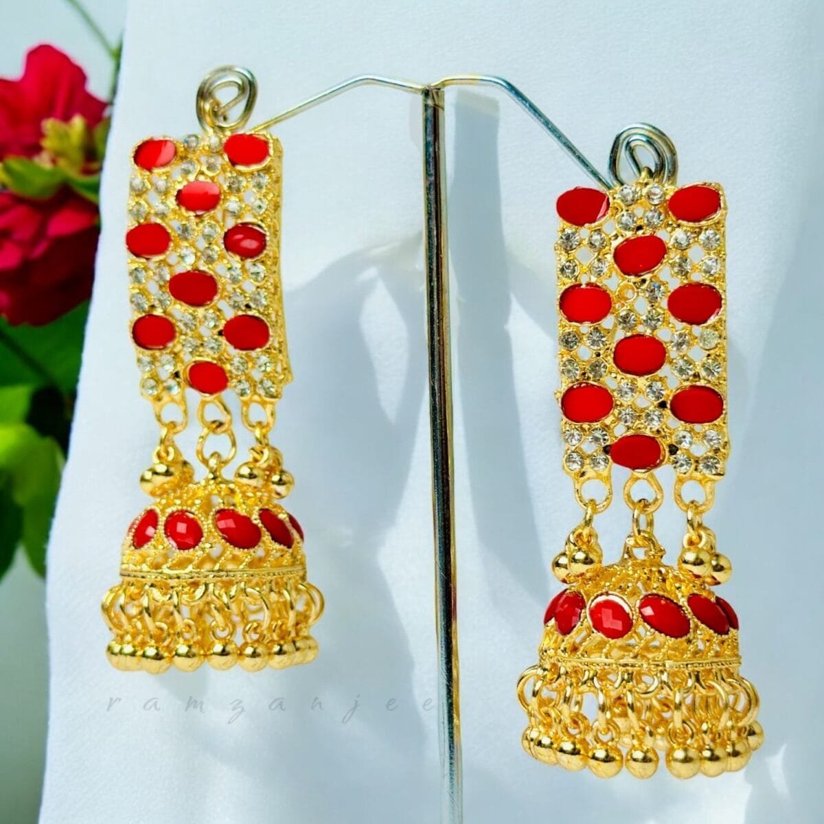 "Elegant earrings with intricate designs, perfect for formal events and evening wear. Available in statement chandelier and drop styles."