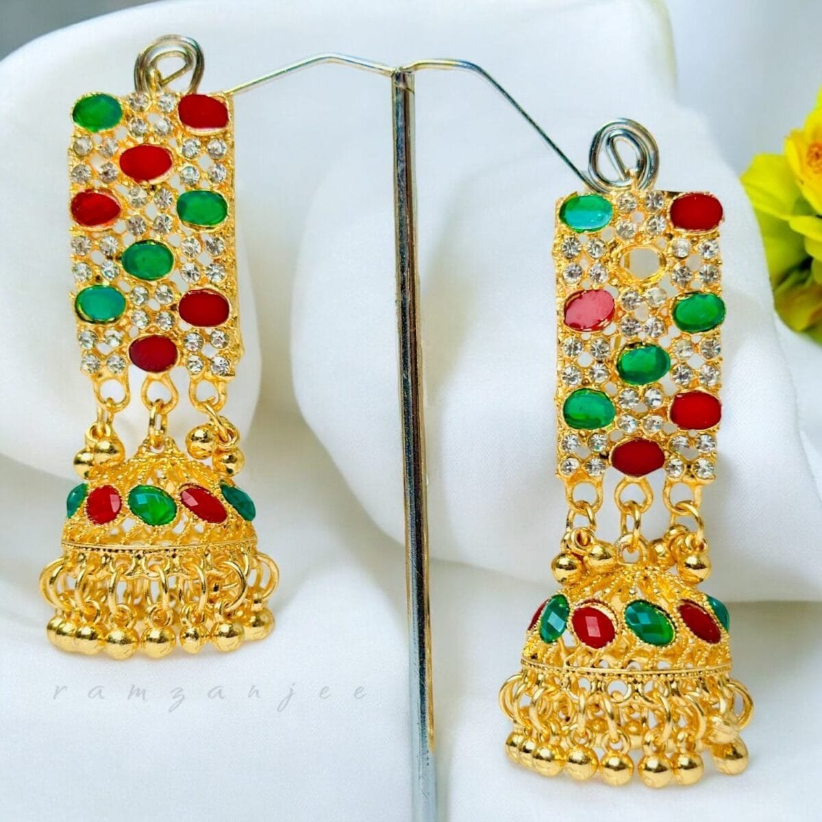 "Elegant earrings with intricate designs, perfect for formal events and evening wear. Available in statement chandelier and drop styles."