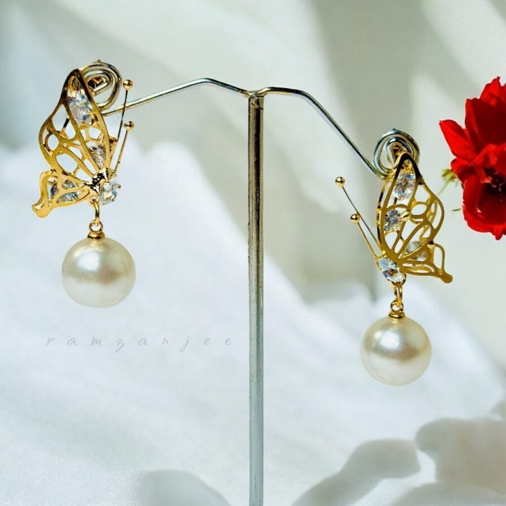 "Elegant earrings with intricate designs, perfect for formal events and evening wear. Available in statement chandelier and drop styles."