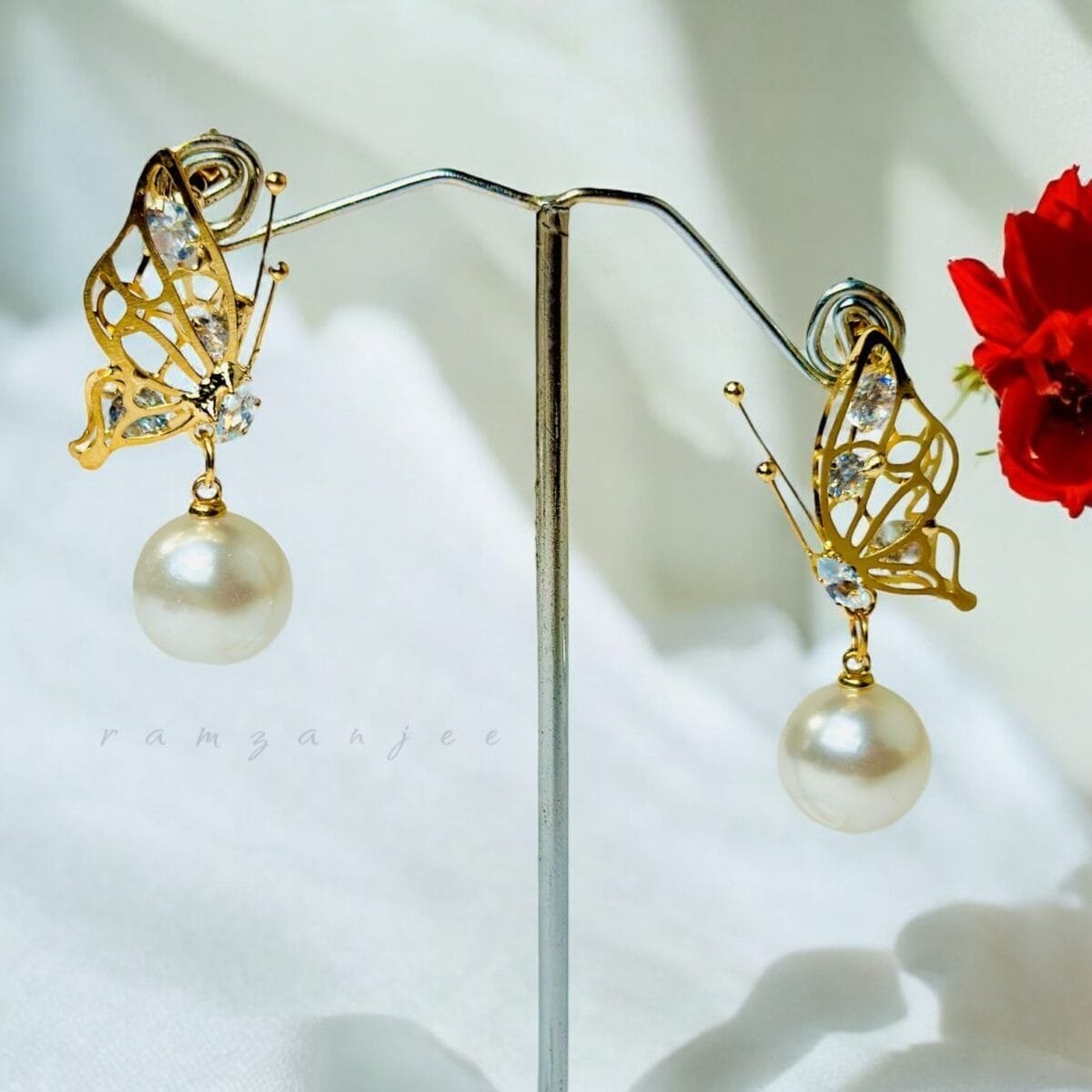 "Elegant earrings with intricate designs, perfect for formal events and evening wear. Available in statement chandelier and drop styles."