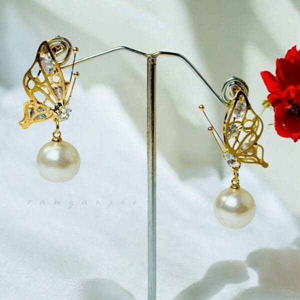"Elegant earrings with intricate designs, perfect for formal events and evening wear. Available in statement chandelier and drop styles."