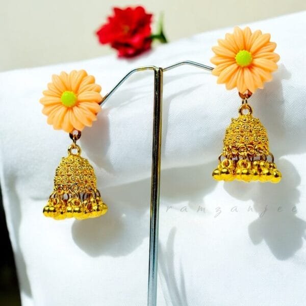 "Elegant earrings with intricate designs, perfect for formal events and evening wear. Available in statement chandelier and drop styles."