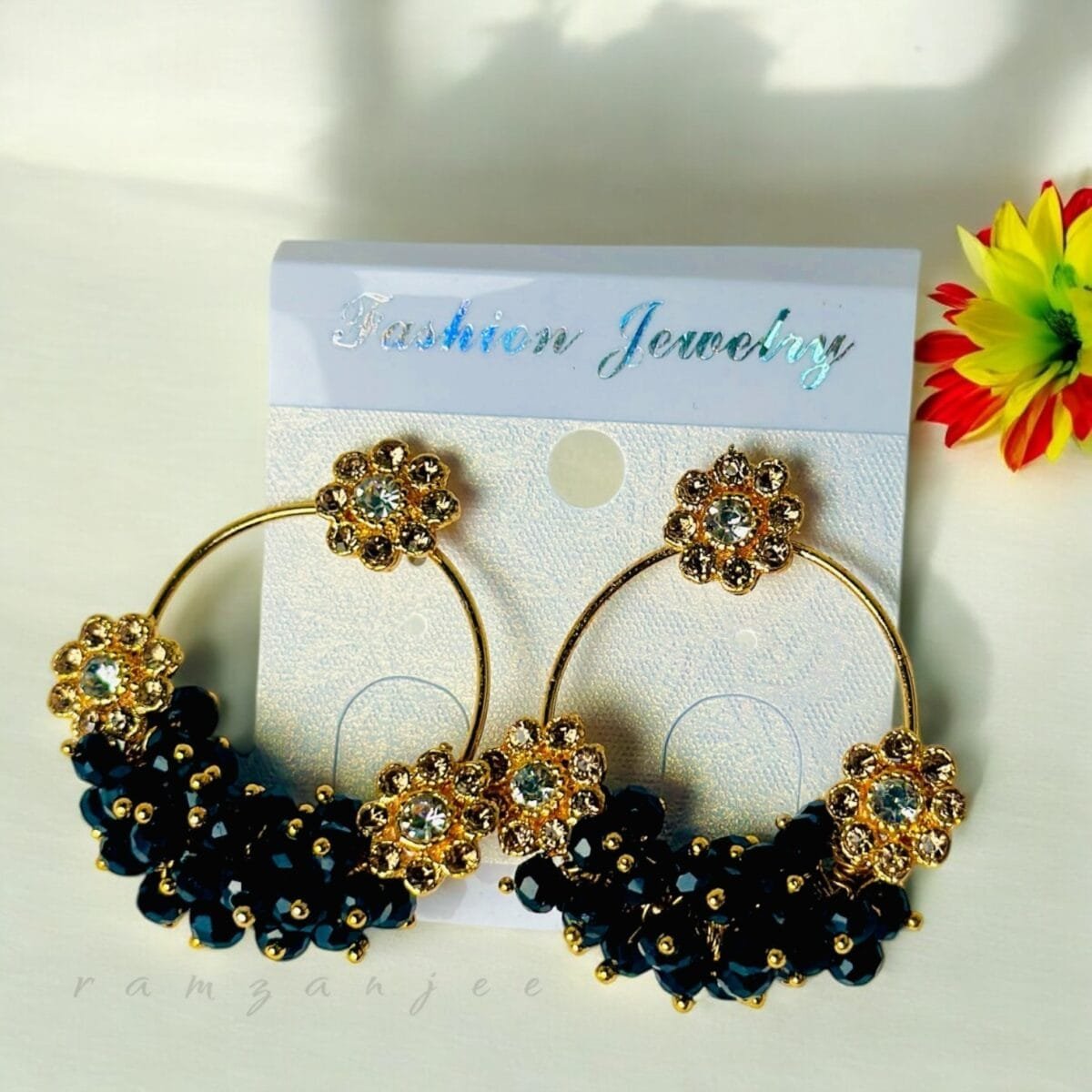 "Elegant earrings with intricate designs, perfect for formal events and evening wear. Available in statement chandelier and drop styles."