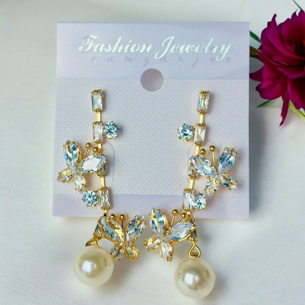 "Elegant earrings with intricate designs, perfect for formal events and evening wear. Available in statement chandelier and drop styles."