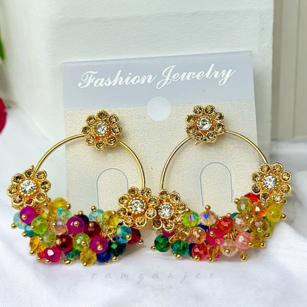 "Elegant earrings with intricate designs, perfect for formal events and evening wear. Available in statement chandelier and drop styles."