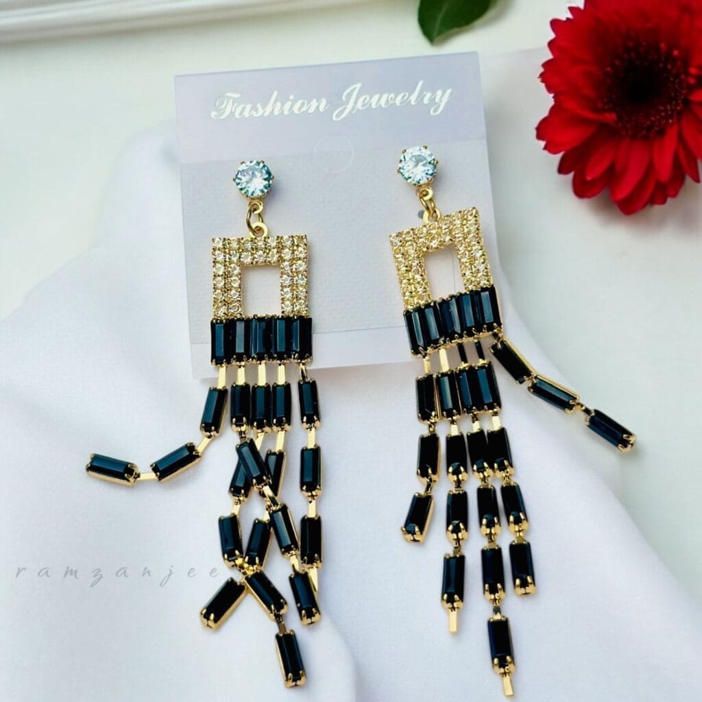 "Elegant earrings with intricate designs, perfect for formal events and evening wear. Available in statement chandelier and drop styles."