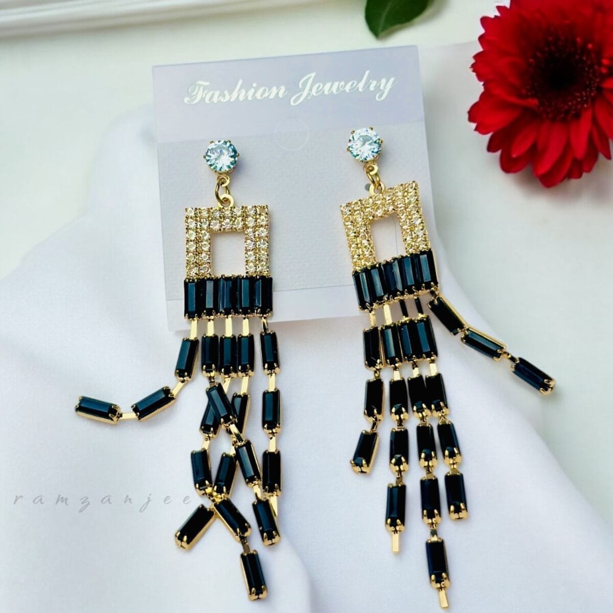 "Elegant earrings with intricate designs, perfect for formal events and evening wear. Available in statement chandelier and drop styles."