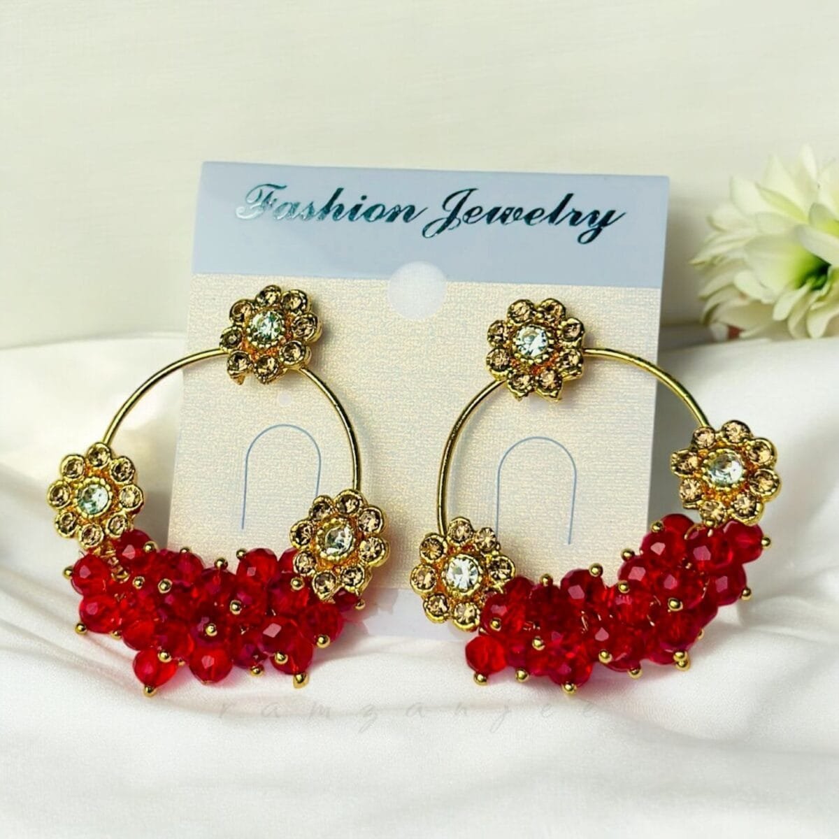 "Elegant earrings with intricate designs, perfect for formal events and evening wear. Available in statement chandelier and drop styles."