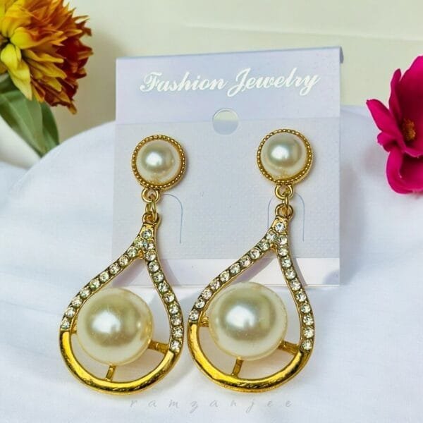 "Elegant earrings with intricate designs, perfect for formal events and evening wear. Available in statement chandelier and drop styles."