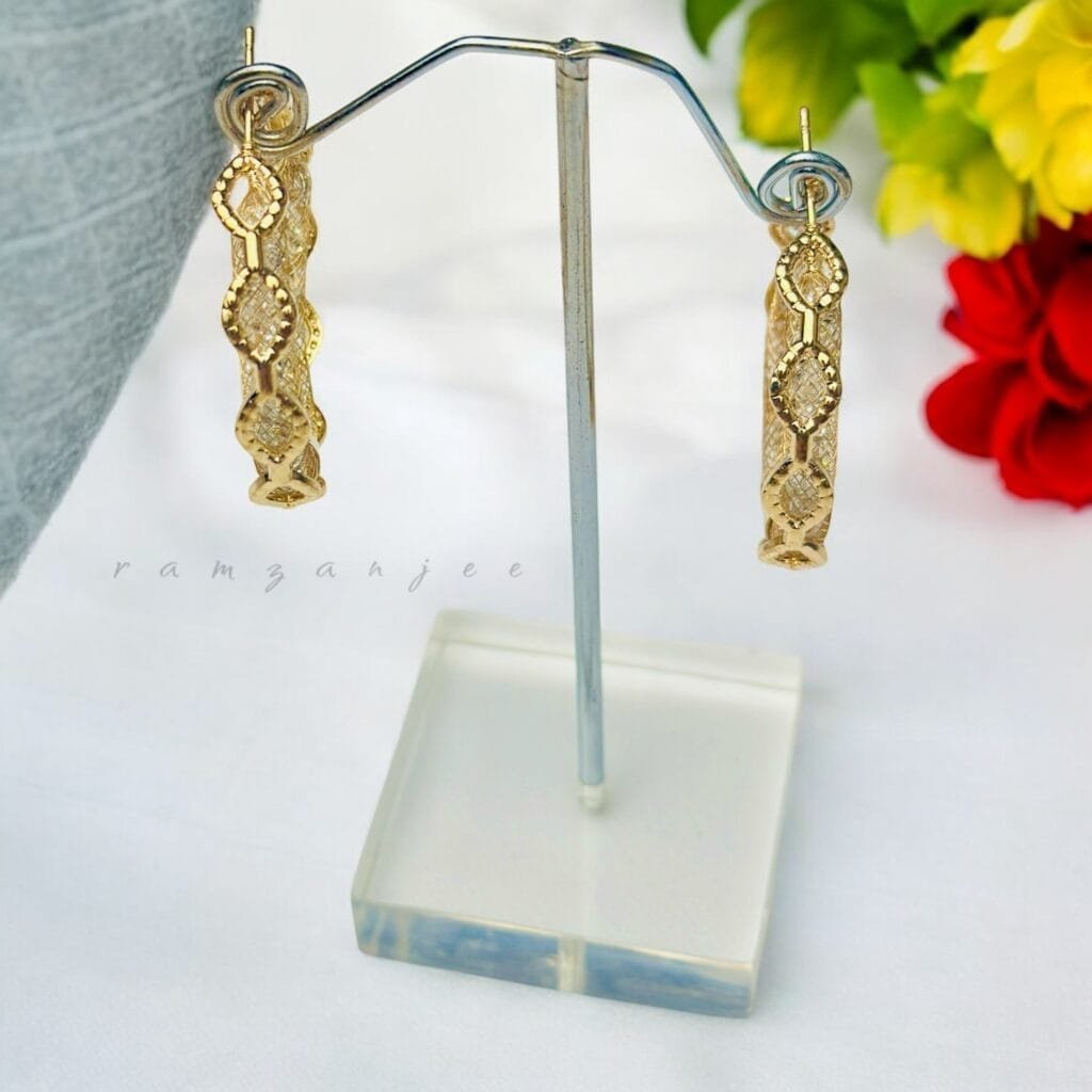 "Elegant earrings with intricate designs, perfect for formal events and evening wear. Available in statement chandelier and drop styles."