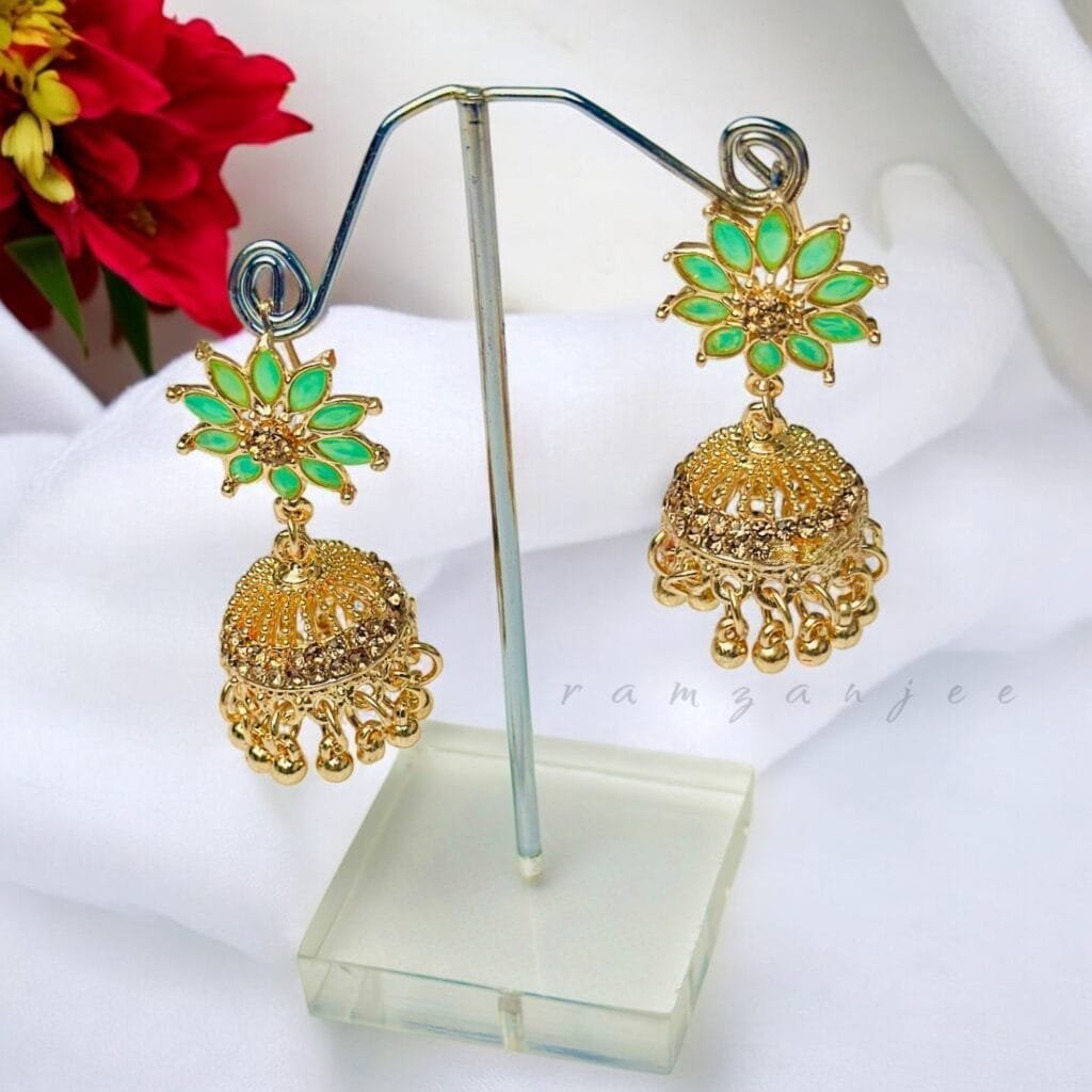 "Elegant earrings with intricate designs, perfect for formal events and evening wear. Available in statement chandelier and drop styles."