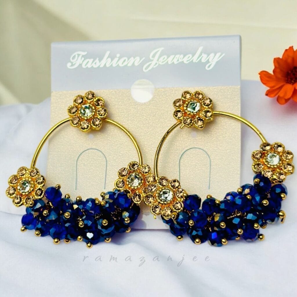 "Elegant earrings with intricate designs, perfect for formal events and evening wear. Available in statement chandelier and drop styles."