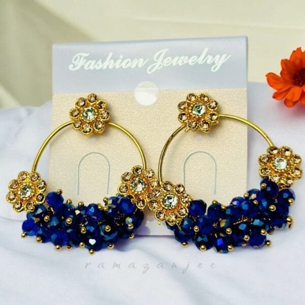 "Elegant earrings with intricate designs, perfect for formal events and evening wear. Available in statement chandelier and drop styles."