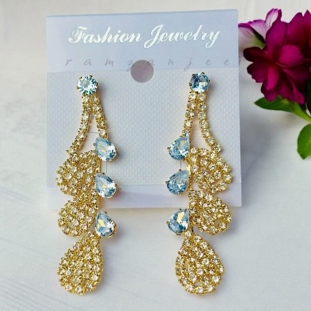 "Elegant earrings with intricate designs, perfect for formal events and evening wear. Available in statement chandelier and drop styles."