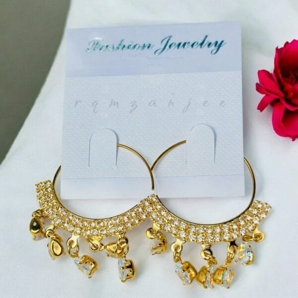 "Elegant earrings with intricate designs, perfect for formal events and evening wear. Available in statement chandelier and drop styles."