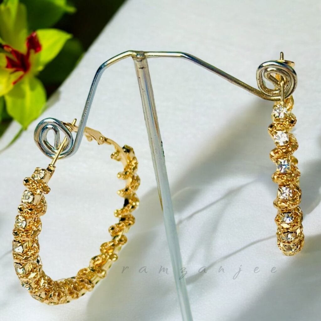"Elegant earrings with intricate designs, perfect for formal events and evening wear. Available in statement chandelier and drop styles."