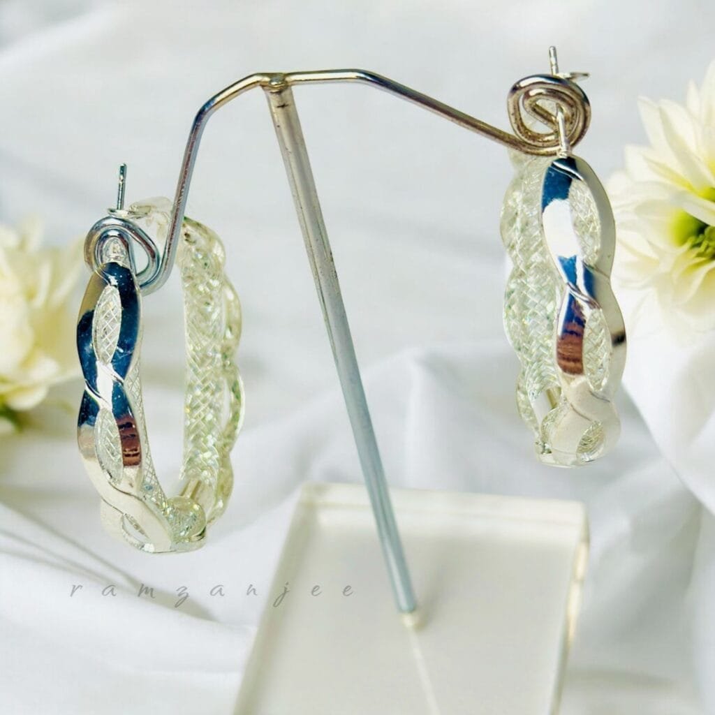 "Elegant earrings with intricate designs, perfect for formal events and evening wear. Available in statement chandelier and drop styles."