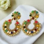 "Elegant earrings with intricate designs, perfect for formal events and evening wear. Available in statement chandelier and drop styles."