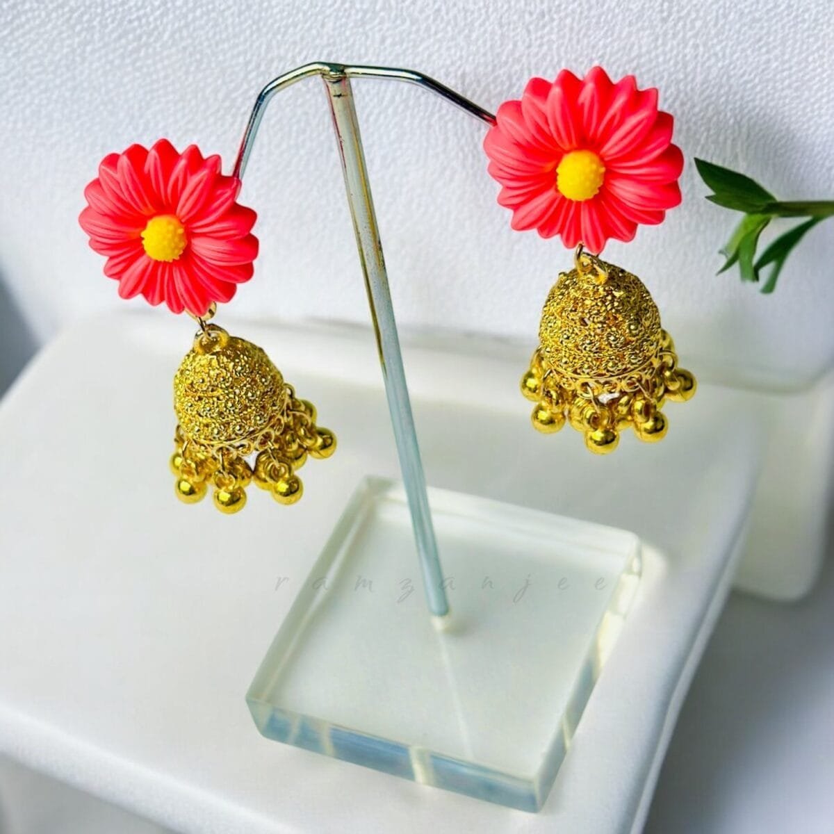 "Elegant earrings with intricate designs, perfect for formal events and evening wear. Available in statement chandelier and drop styles."