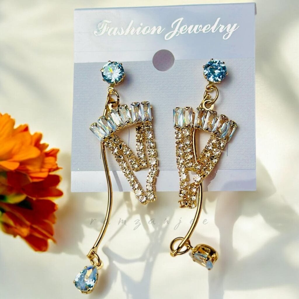 "Elegant earrings with intricate designs, perfect for formal events and evening wear. Available in statement chandelier and drop styles."