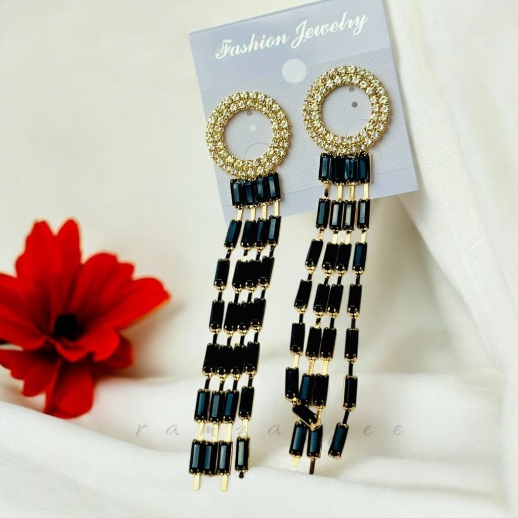 "Elegant earrings with intricate designs, perfect for formal events and evening wear. Available in statement chandelier and drop styles."