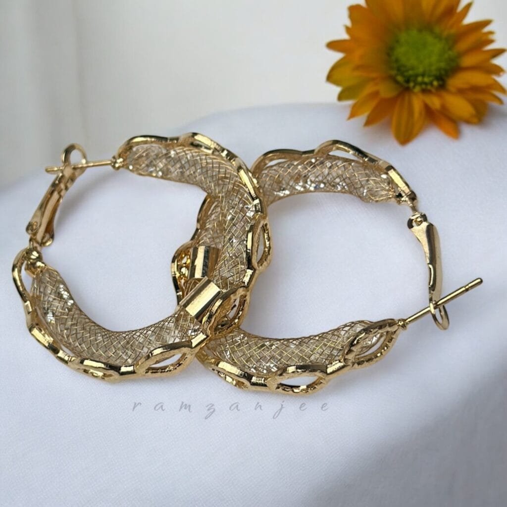 "Elegant earrings with intricate designs, perfect for formal events and evening wear. Available in statement chandelier and drop styles."