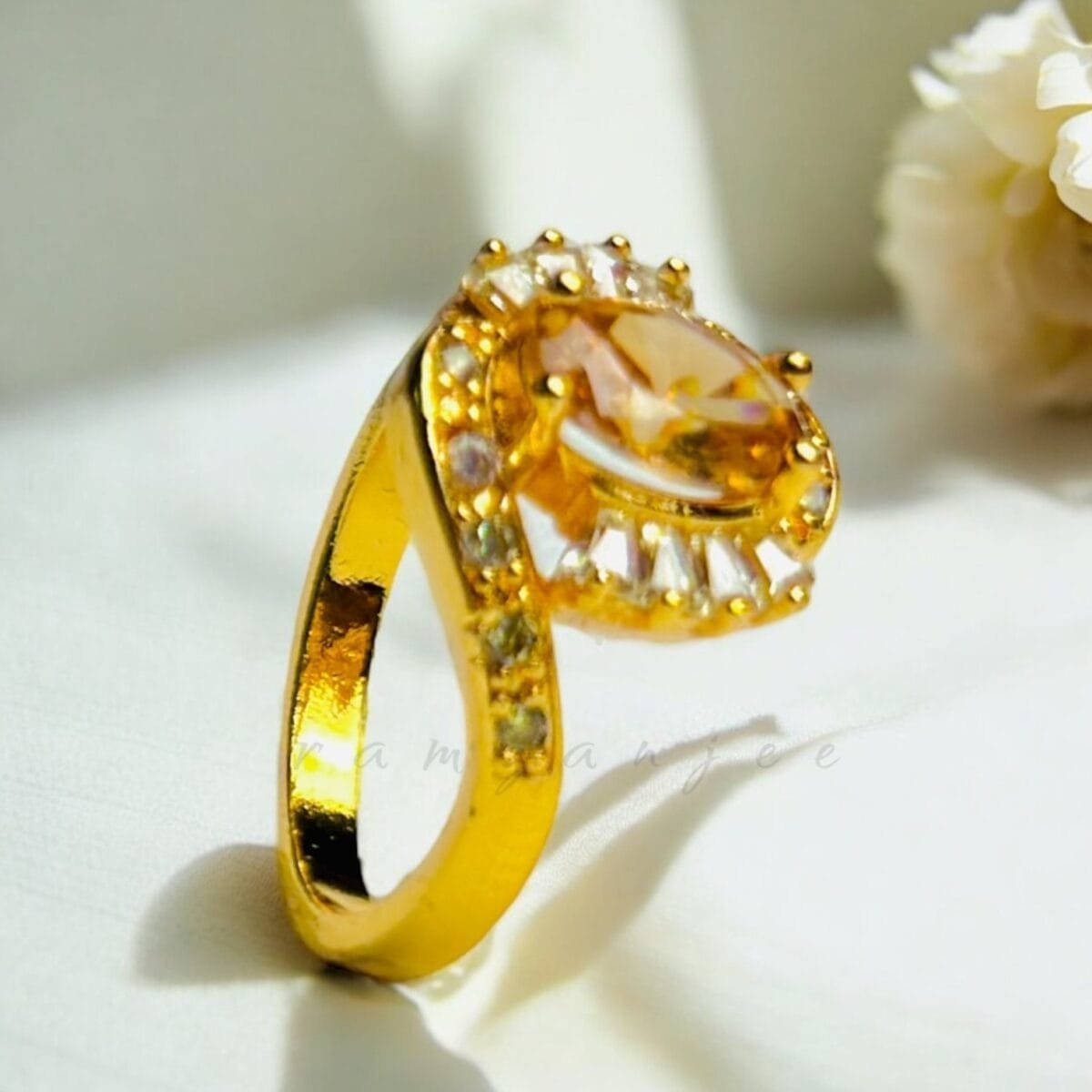 "Elegant diamond engagement ring in a gold band, perfect for weddings."