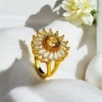 "Elegant diamond engagement ring in a gold band, perfect for weddings."