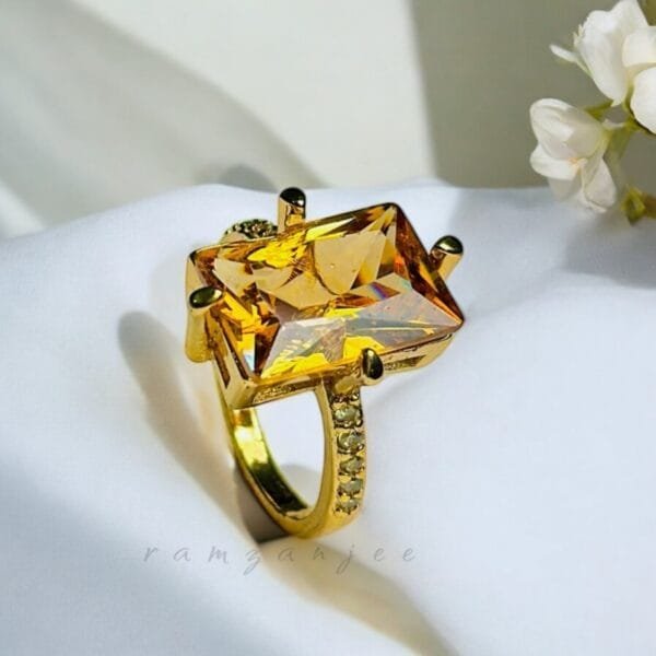 "Elegant diamond engagement ring in a gold band, perfect for weddings."