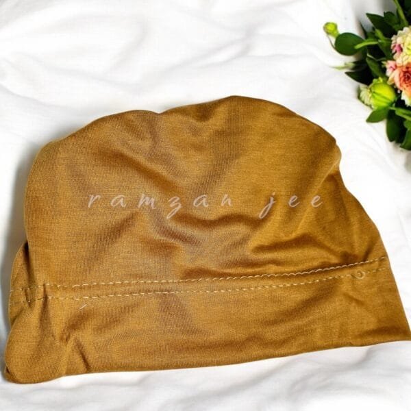 "Lightweight and colorful hijab cap, ideal for layering under silk or chiffon hijabs."