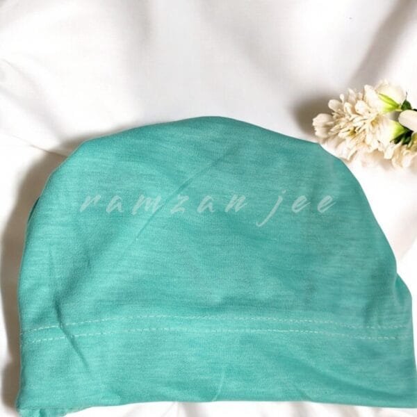 "Lightweight and colorful hijab cap, ideal for layering under silk or chiffon hijabs."